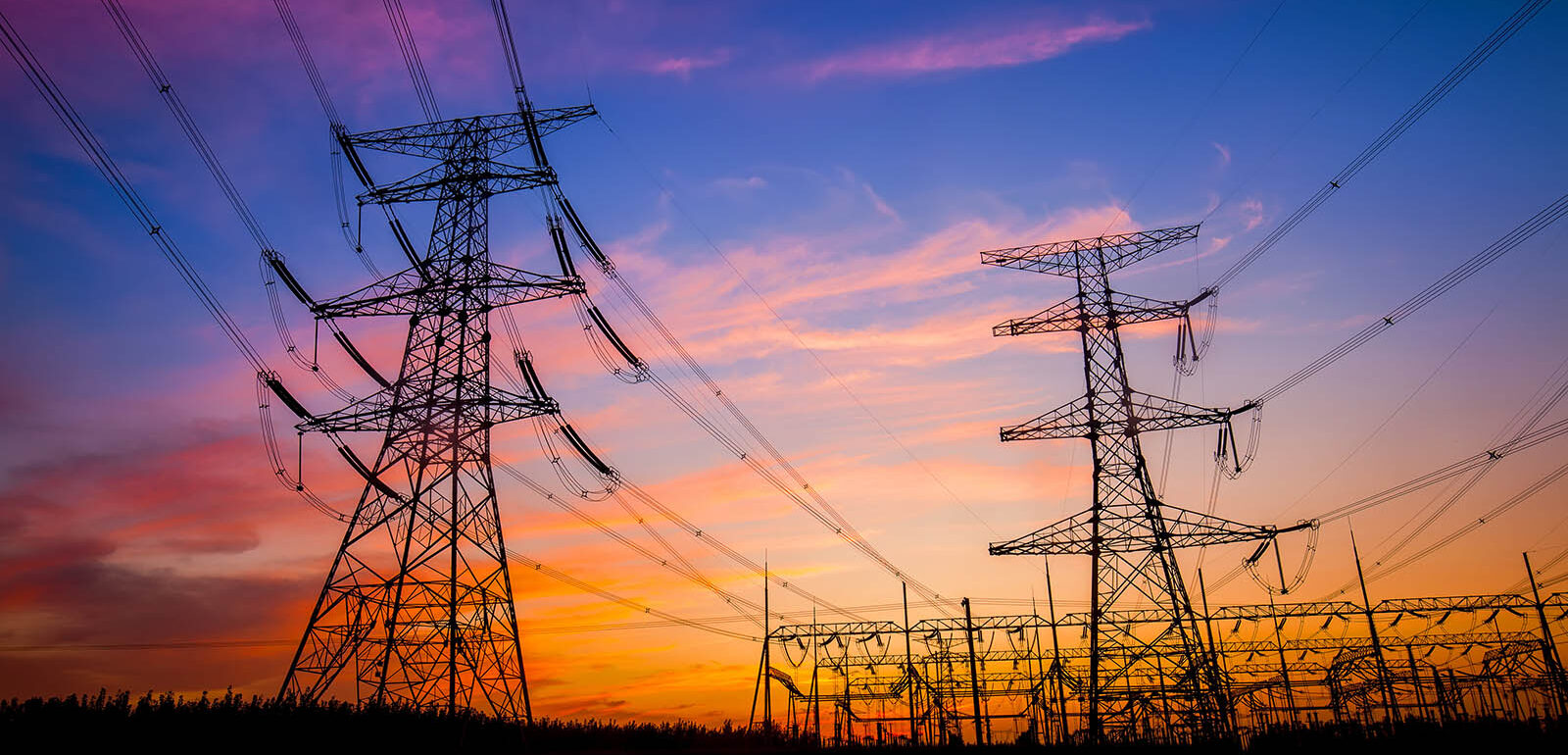 Electricity pylons at sunset